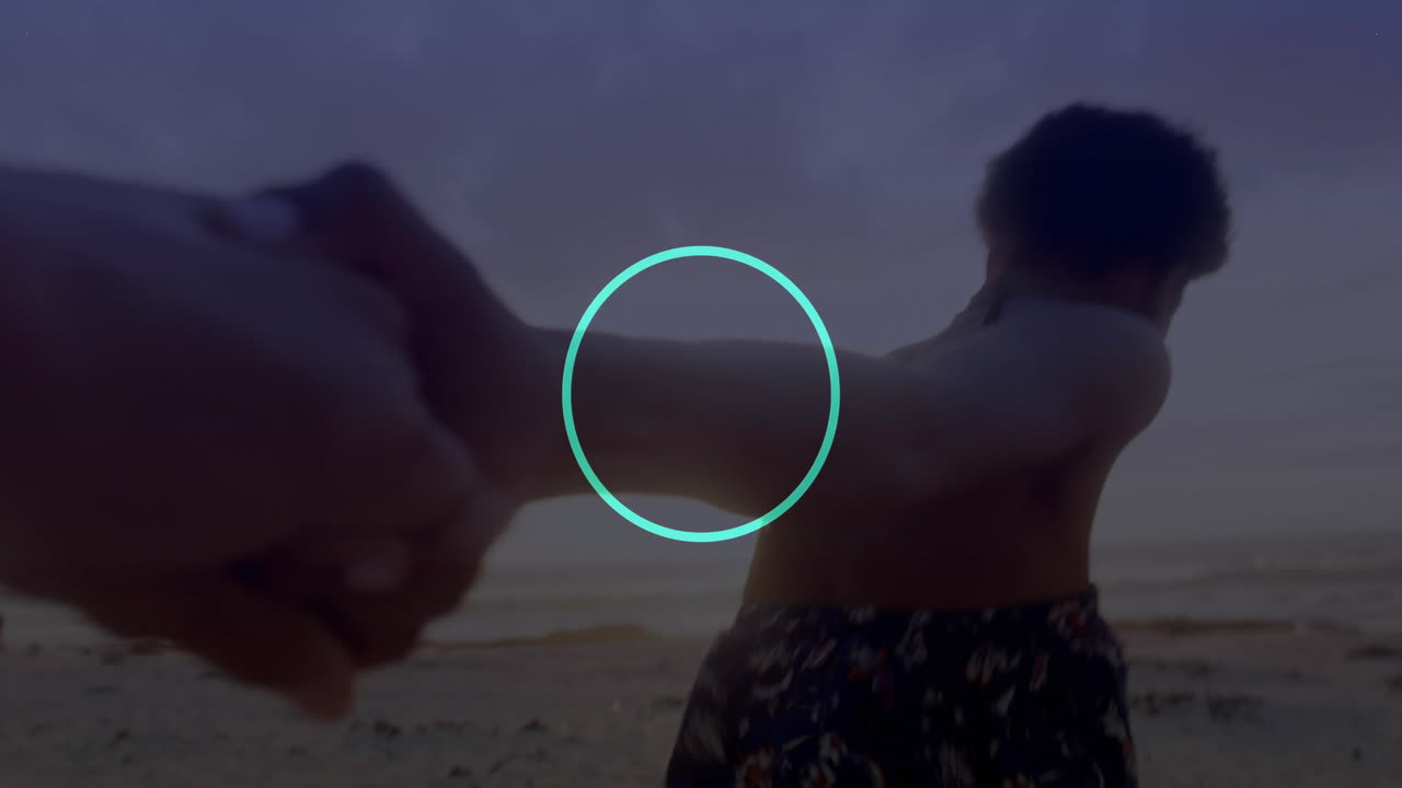 Couple holding hands on beach with blue dot pattern animation overlay