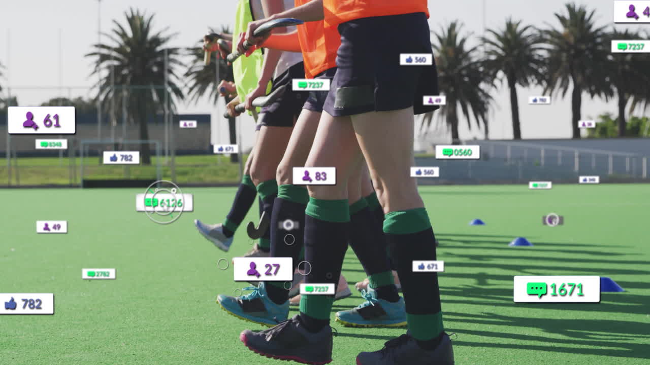Female athletes practicing field hockey training on turf, showing floating social media icons