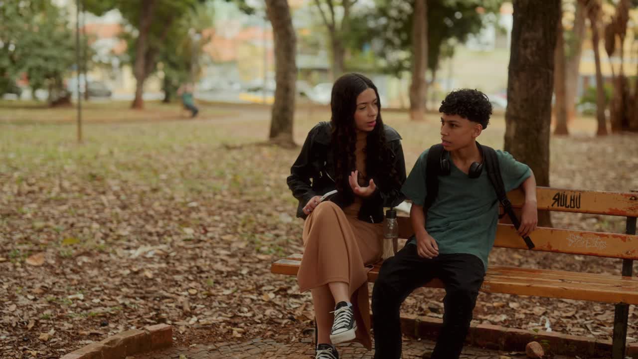 Young People Relaxing and Socializing in a Park