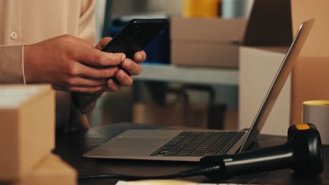 E-commerce storage shop, woman packing goods and clothes for second hand delivery market, dedicated Packaging and Shipping Workspace with Supplies and Technology for efficiency, online sales.