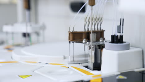 device parts are moving going up and down. close up. technological equipment working in the advanced laboratory for medical testing.