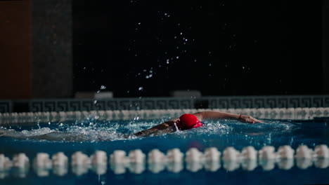 woman swimming freestyle in a pool