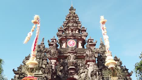 Balinese-Traditional-Building-Ardha-Candra-Stage-Denpasar-Over-Blue-Skyline-Bali-Architecture,-Indonesia,-Artistic-and-Cultural-Stage