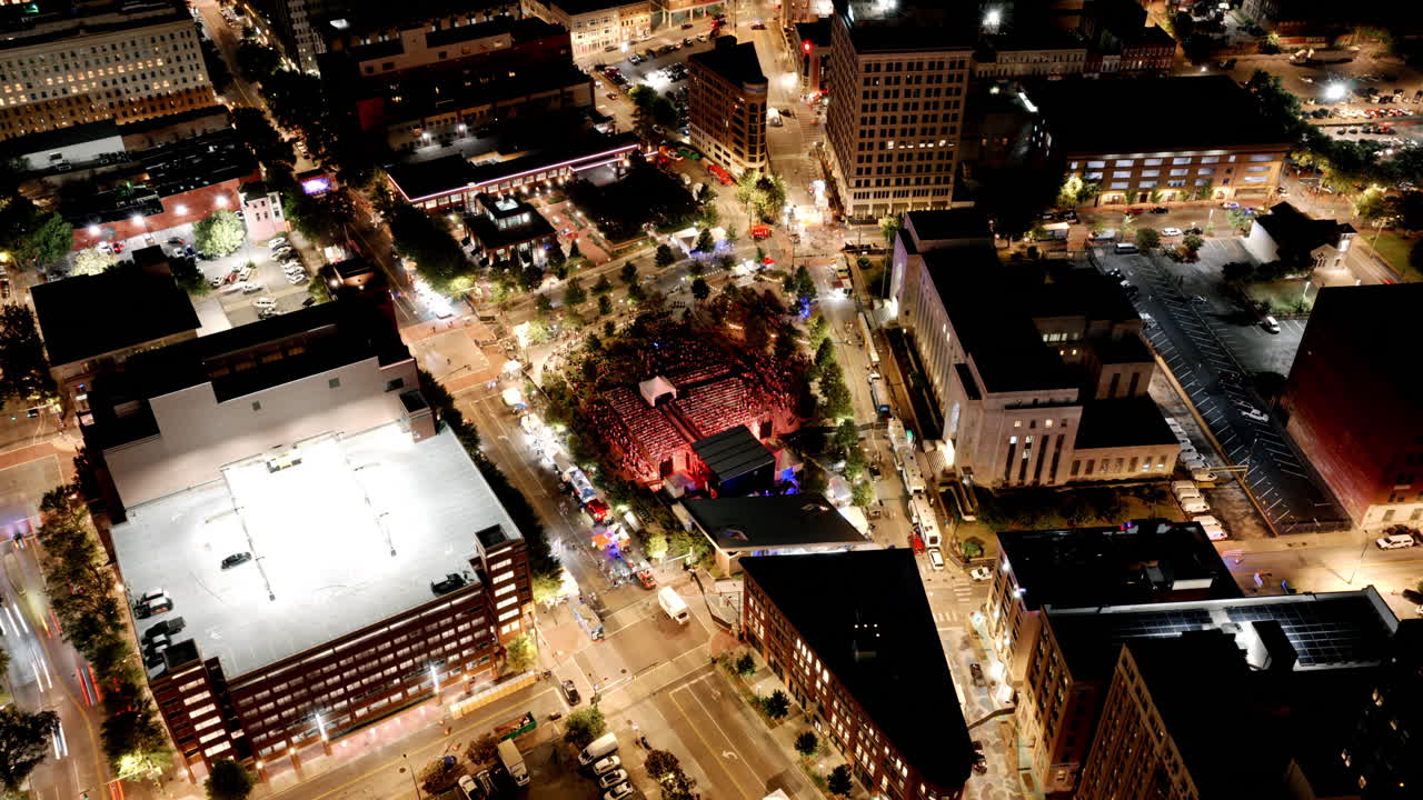 Downtown Chattanooga glowing at night as concert lights illuminate the plaza for the International Bluegrass Awards event