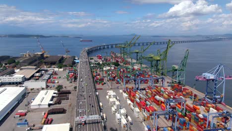 aerial view of shipping docks and container port next to rio-niteroi bridge in rio de janeiro, brazil