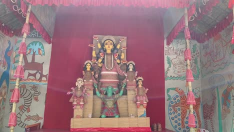 low angle shot of goddess durga idol decorated at puja pandal in kolkata, west bengal in india at daytime