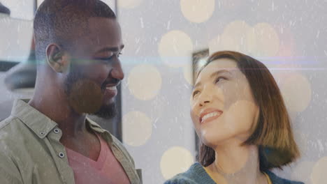 smiling couple with bokeh lights animation overlay