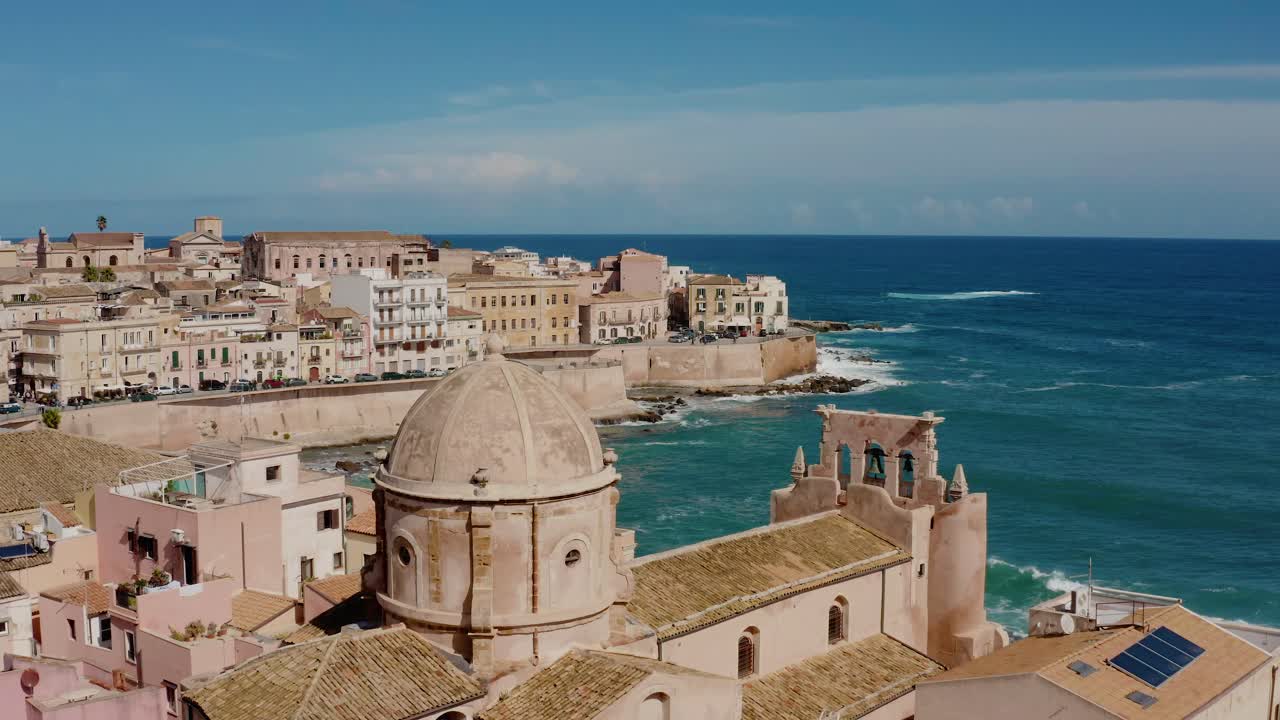 Aerial view of cathedral tower in Ortigia island. Chiesa dello Spirito Santo. Historic old town by the Mediterranean sea in Syracuse. UNESCO world heritage site in Sicily.