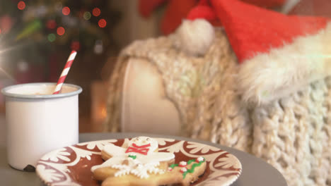 digital composition of spots of light against cup of hot chocolate and gingerbread man in plate duri