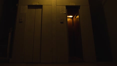 two elevators in a dark building at night