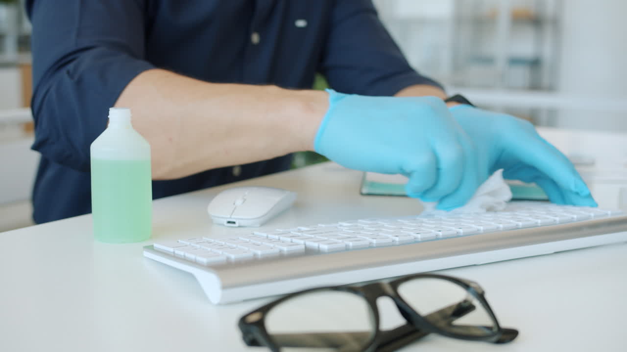 Cleaning a Computer Keyboard with Gloves