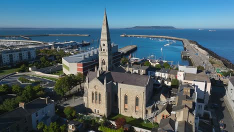 maritime museum, county dublin, dun laoghaire, september 2024. drone orbits clockwise around the mariners' church with views north of the harbour, howth and dublin bay on a bright sunny day.