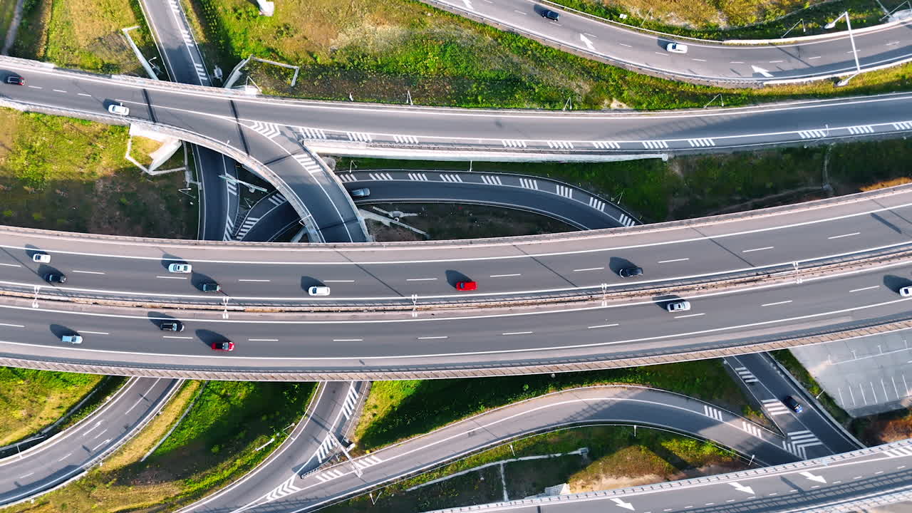 Approaching the highways in the complicated system of road conjunction. Loops and highways in the countryside of Slovakia. Top view.