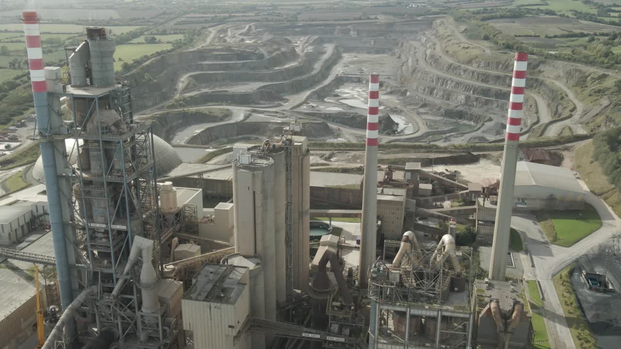 Irish Cement plant and quarry in County Louth, Ireland with tall chimneys and surrounding greenery