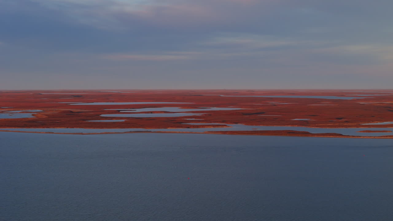 A Scenic View of Tuktoyaktuk, a Small Inuvialuit Community Nestled in the Northwest Territories (NWT) of Canada - Wide Shot