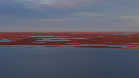 a scenic view of tuktoyaktuk, a small inuvialuit community nestled in the northwest territories (nwt) of canada - wide shot