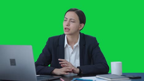 Serious-Indian-female-manager-talking-to-employees-Green-screen