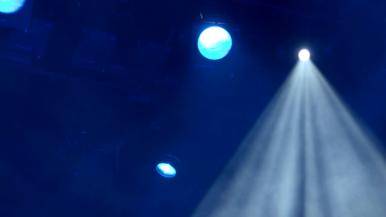 The spotlight through the smoke on stage. Lighting equipment. Effect Lights. Scanner. Color Changers. Moving Yoke. Moving Head