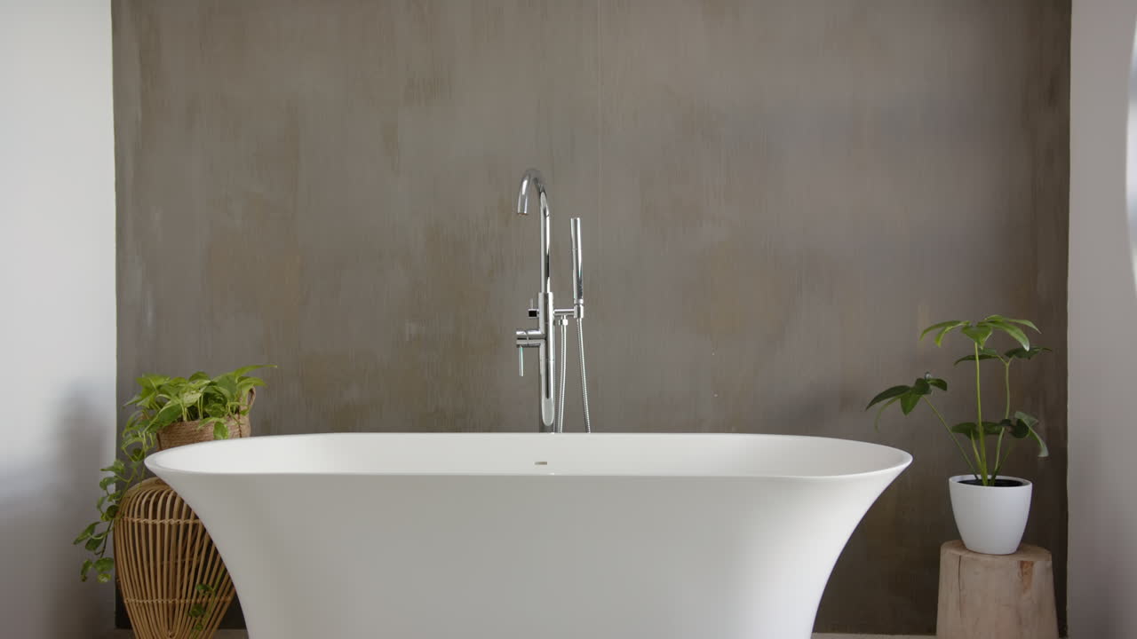 Modern bathtub with plants, creating serene spa-like atmosphere for relaxation, copy space