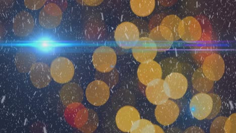 animation of snow falling over christmas light bokeh on blue background