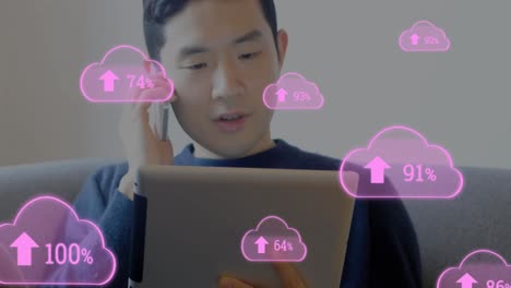 multiple cloud icon with increasing percentage against man holding digital tablet talking on smartph