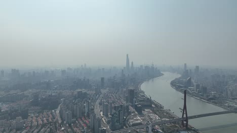 huangpu river and industry area with lujiazui downtown in background