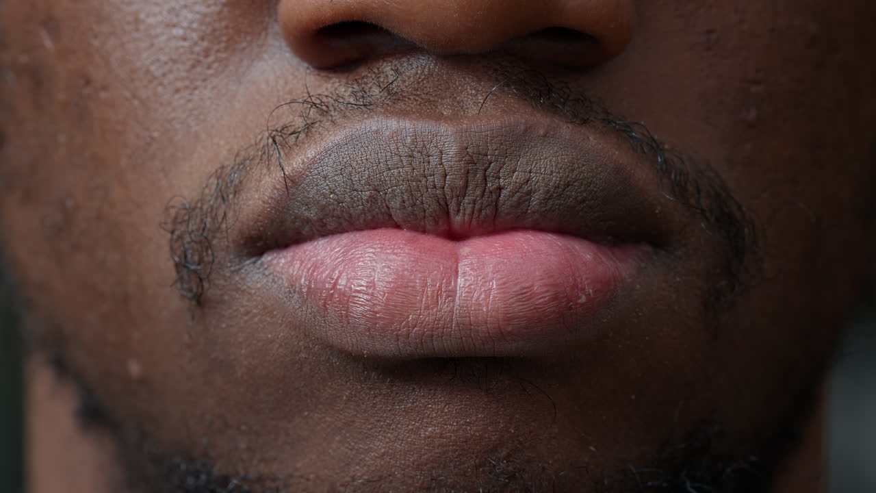 Macro shot of young man smiling in front of camera
