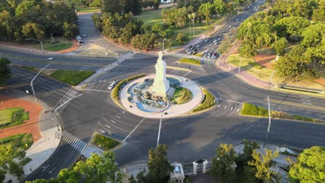 Buenos-Aires-Drone-view-over-Palermo-park-Libertador-Avenue-traffic-scene-tilt-up-to-city-landscape