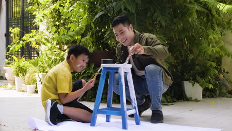 asian man and boy in the backyard