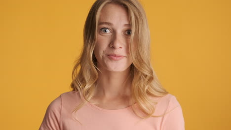 Caucasian-woman-calmly-looking-and-smiling-at-camera.