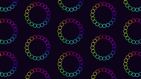 Repeat-futuristic-circles-pattern-with-rainbow-glitters-on-black-gradient