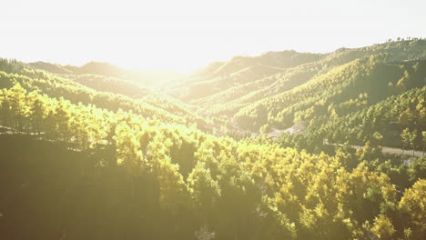 sunrise over vibrant green hills creates a serene landscape