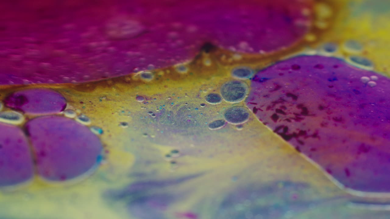 Colourful, organic, liquids macro shots buzzing and flowing