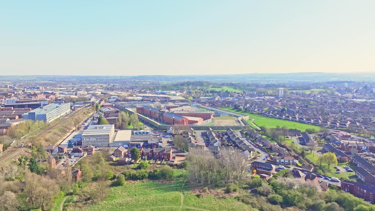 Aerial view of Wakefield city, West Yorkshire, England, showcasing the HM Prison Wakefield, known as ‘Monster Mansion,’ surrounded by the suburban landscape.