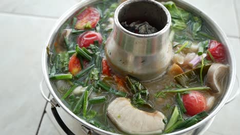 Close-Up-Footage-of-Hot-and-Spicy-Red-Tail-Cat-Fish-Tum-Yum-Soup