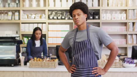 animation of happy biracial waiter standing in coffee shop