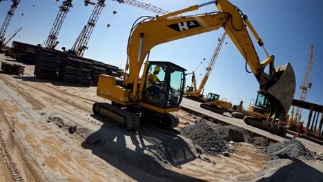 construction site with excavator and cranes