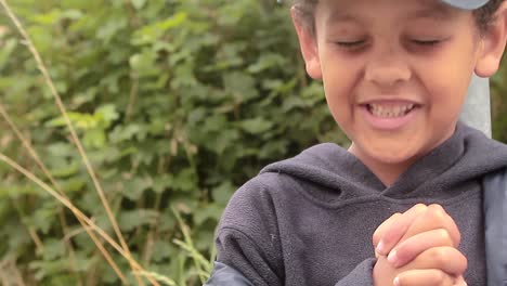 little boy praying to god with hands together stock footage-2