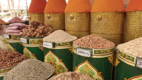 colourful containers filled with herbs and spices on morocco food market