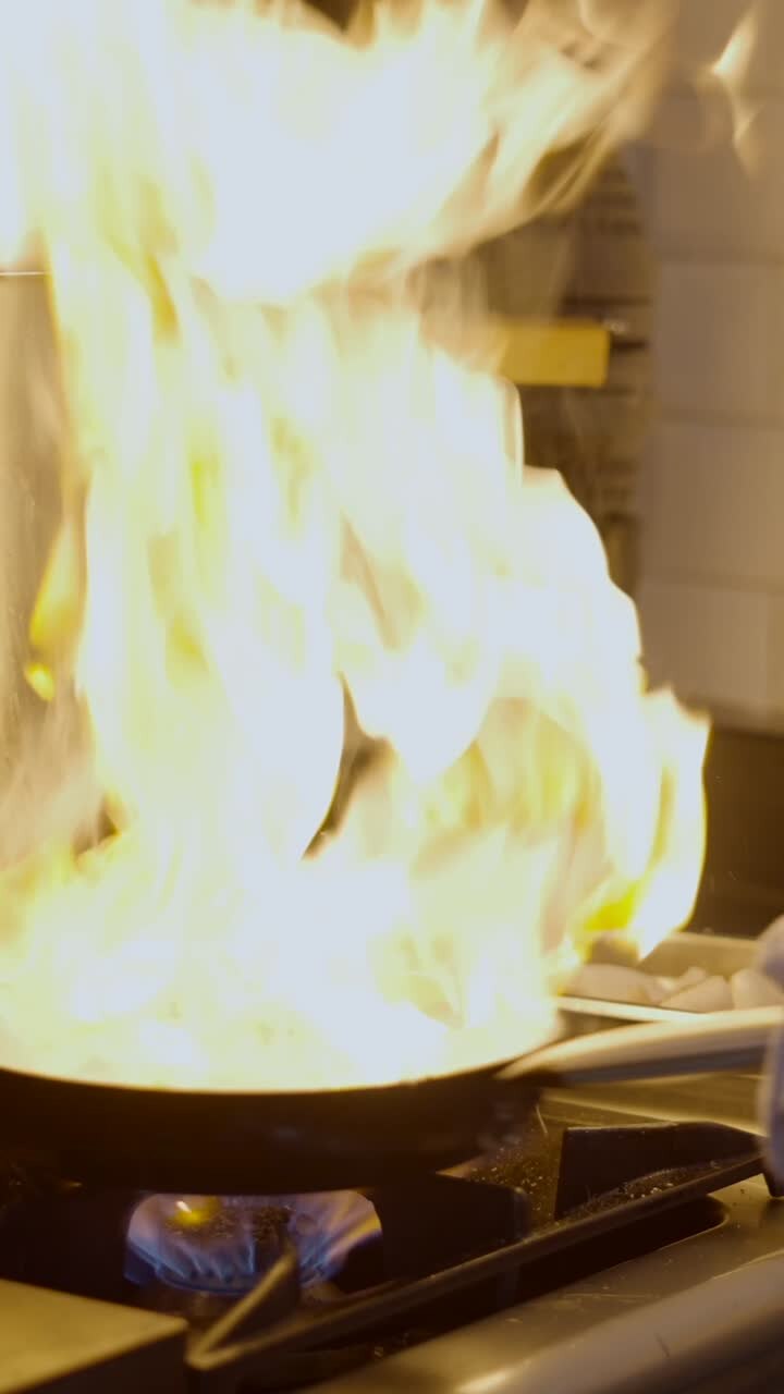 Dramatic Flambeing Action in a Professional Kitchen
