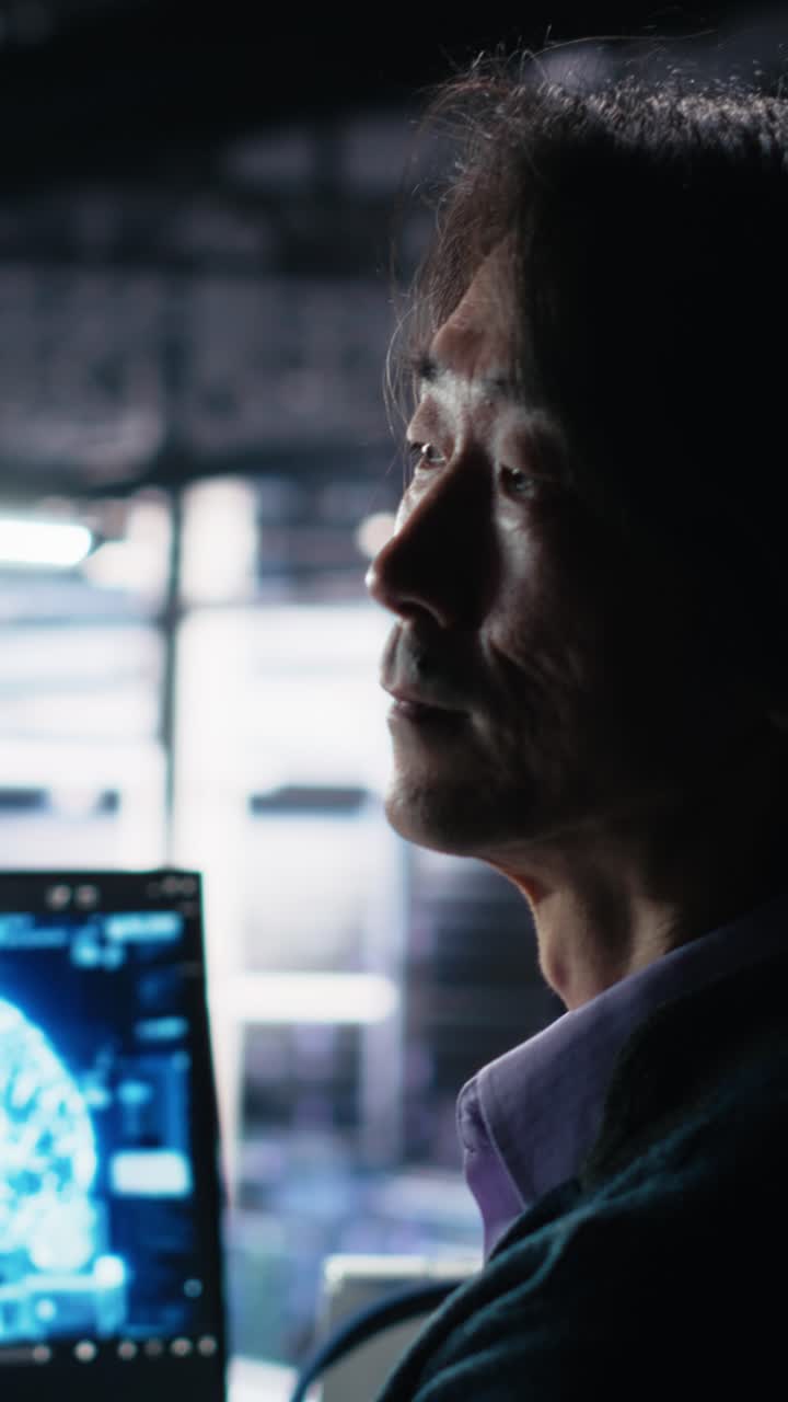 Vertical video Data center software developer using computer to monitor neural network AI LLM