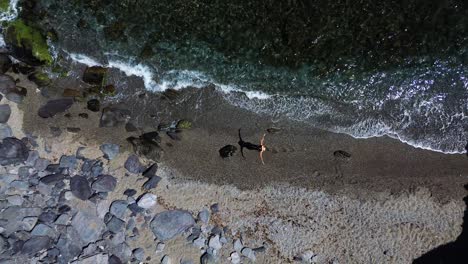 people at the beach aerial drone view playing beach tennis, sunbathing, enjoy holidays at the seashore