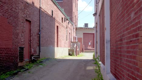 alleyway in between two brick buildings