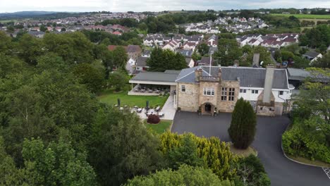 aerial video on dalmeny park, a luxurious scottish country mansion hotel with lush gardens and views of and nearby population