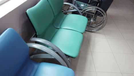 hospital waiting area with chairs and wheelchair