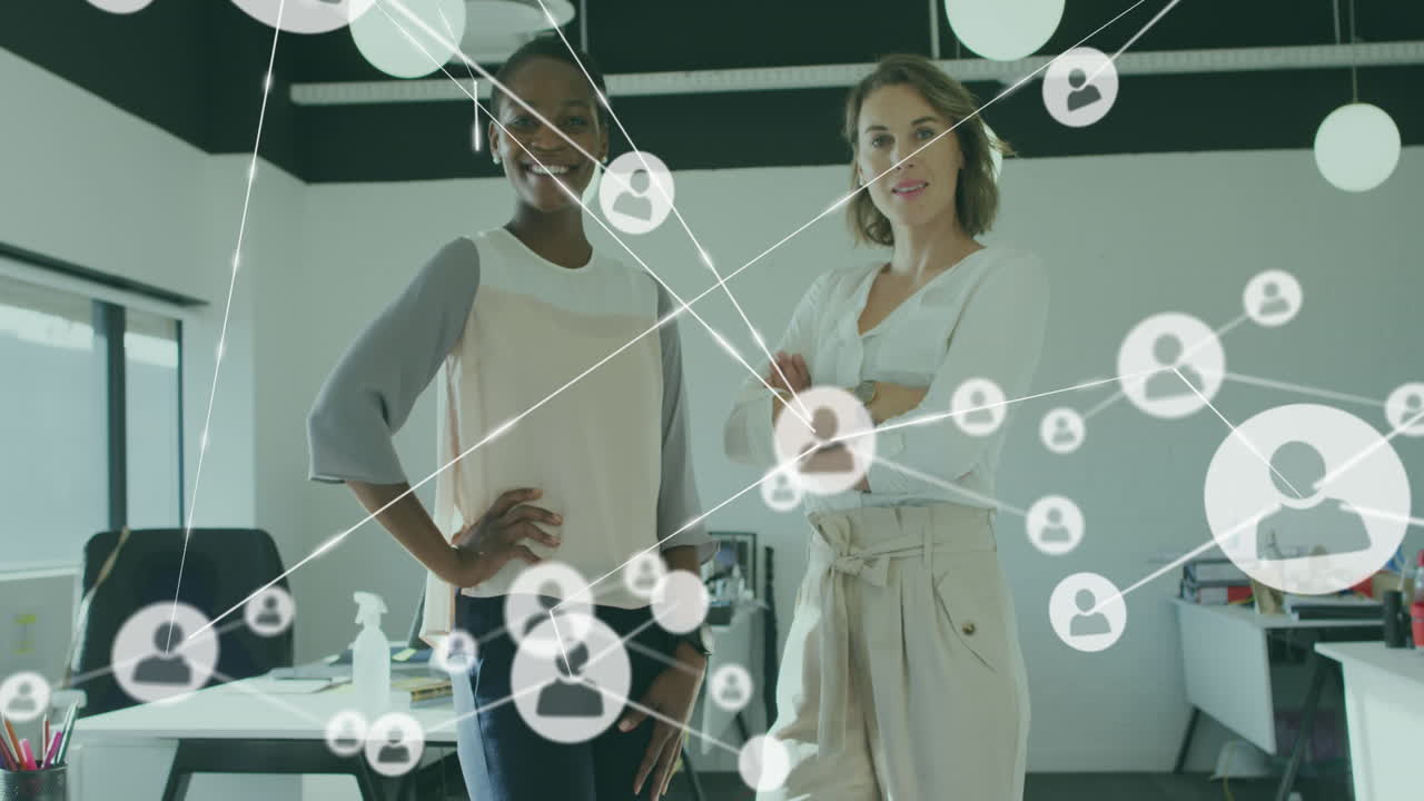 Animation of icons connected with lines over smiling diverse coworkers standing in office