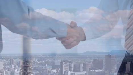 animation of business people shaking hands over cityscape