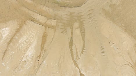 Direct-aerial-of-the-still-wet-sand-from-Lake-Michigan