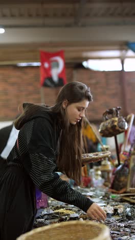 woman browsing a market stall