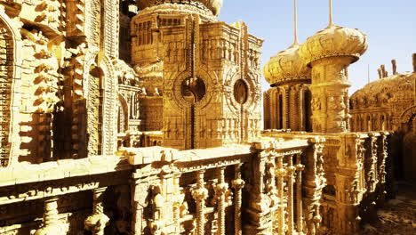detailed view of an elaborate golden architectural structure in bright sunlight